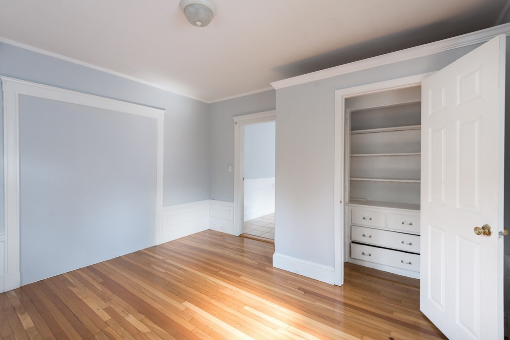 112 Brush Hill Road Milton, MA 02186 - Photo 25 of 42 a view of empty room with wooden floor