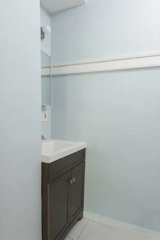 a bathroom with a sink and vanity