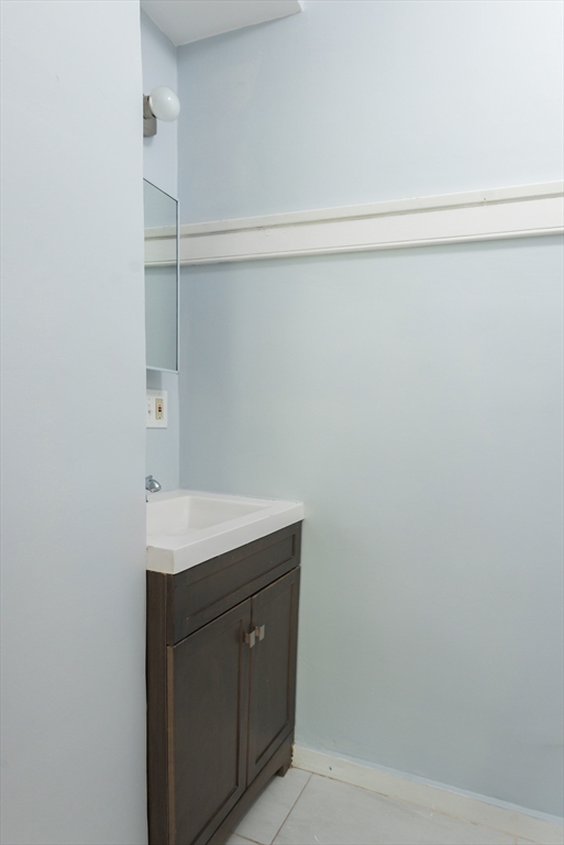 112 Brush Hill Road Milton, MA 02186 - Photo 27 of 42 a bathroom with a sink and vanity