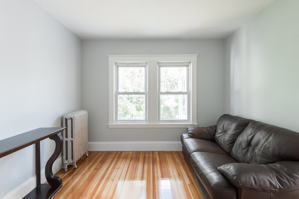 112 Brush Hill Road Milton, MA 02186 - Photo 29 of 42 a living room with furniture and a window