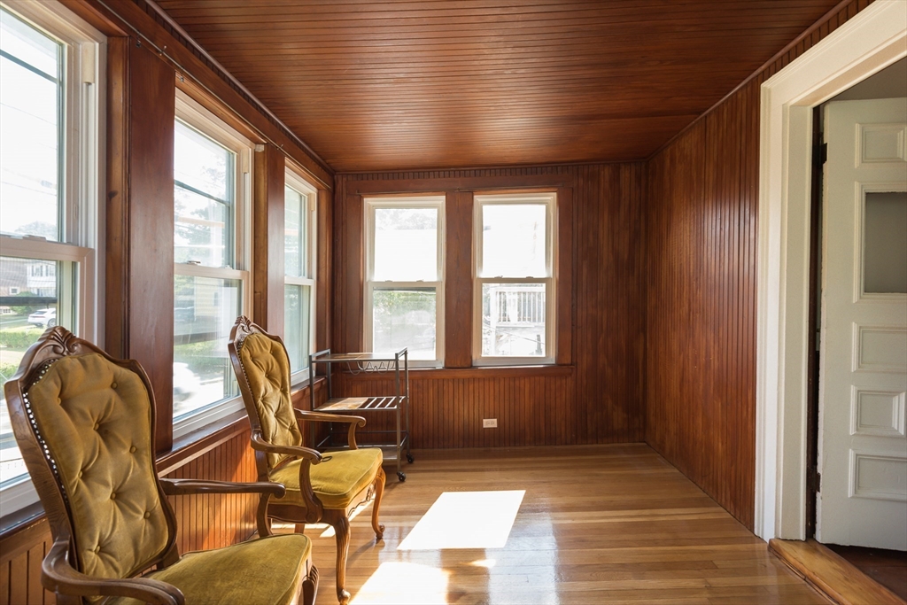 112 Brush Hill Road Milton, MA 02186 - Photo 35 of 42 a living room with furniture and floor to ceiling windows