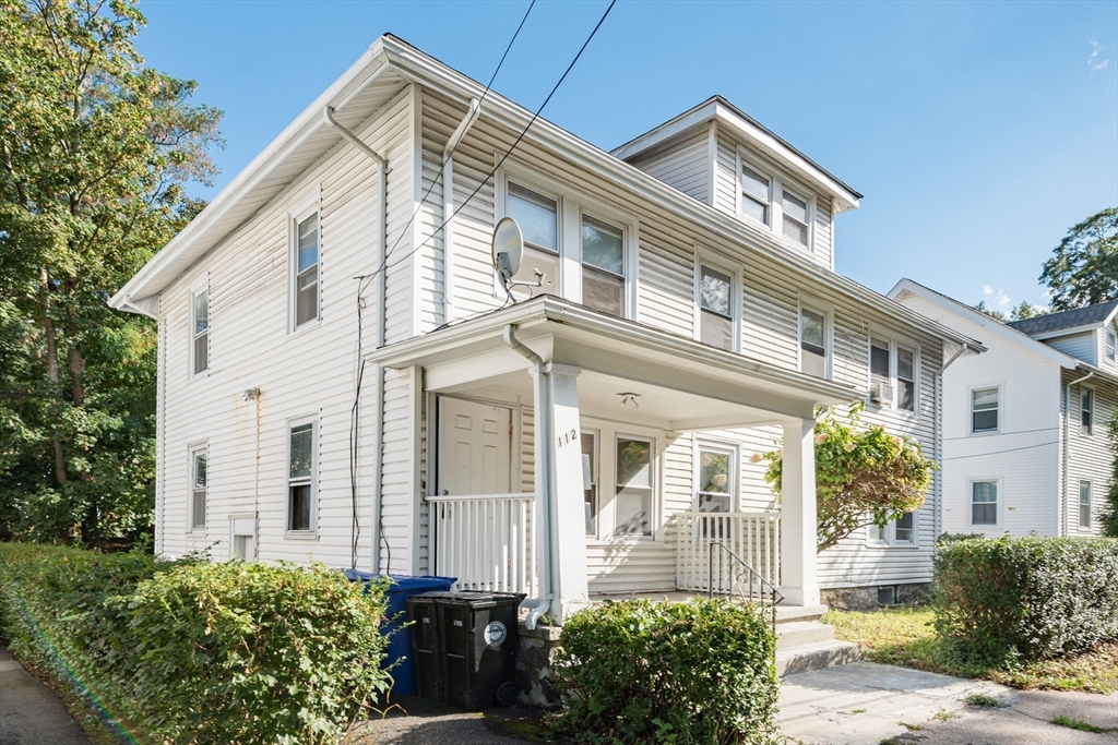 112 Brush Hill Road Milton, MA 02186 - Photo 41 of 42 a front view of a house with a garden
