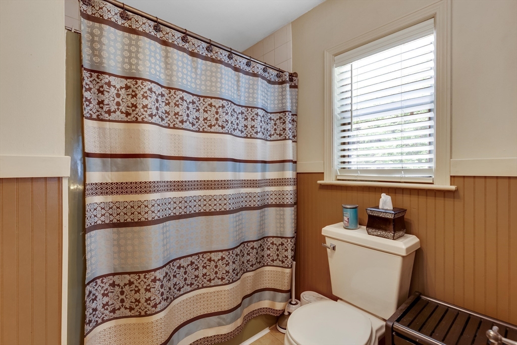 15 Conestoga Road Lexington, MA 02421 - Photo 15 of 31 a bathroom with a toilet a sink and a window