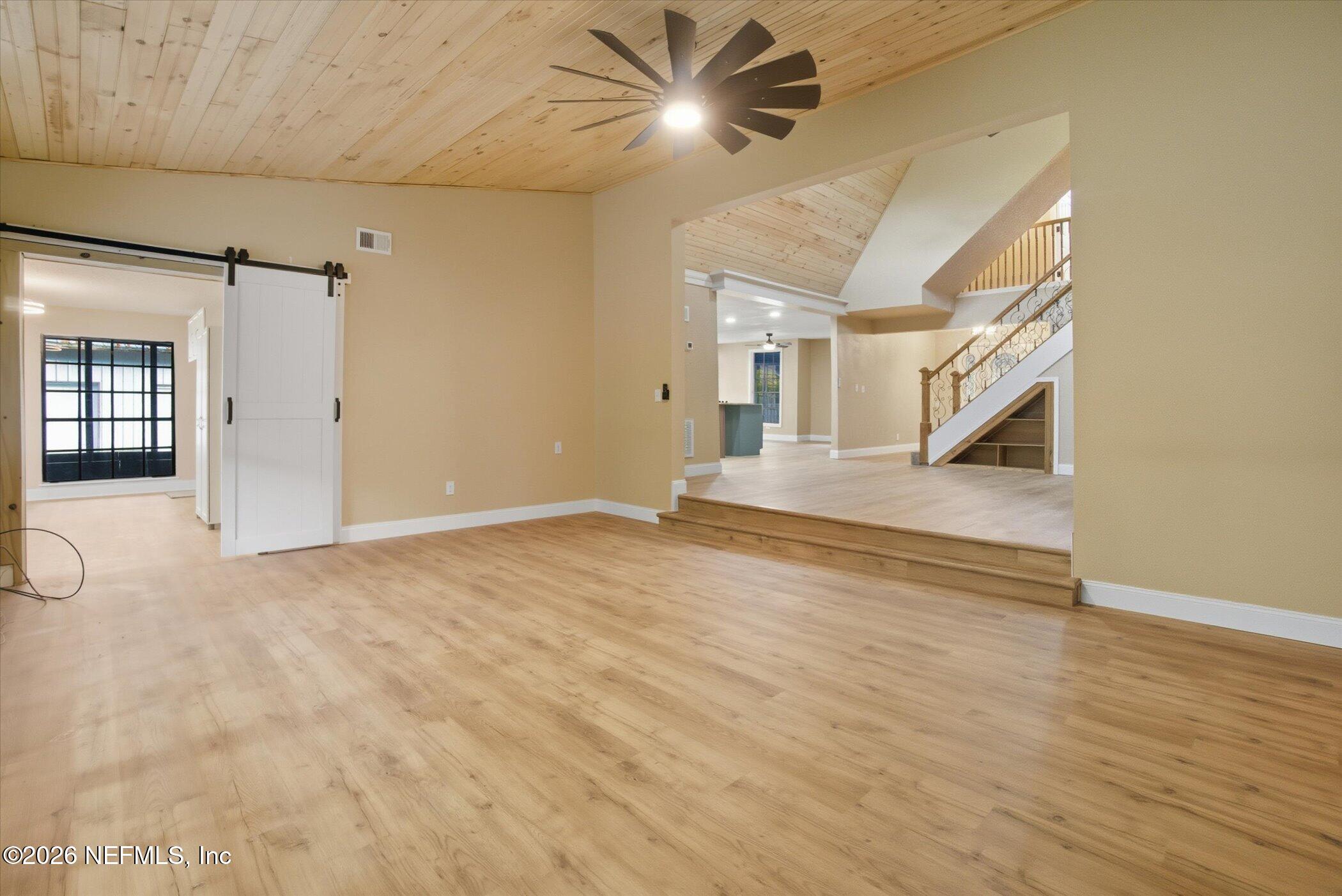 3121 Lannie Road Jacksonville, FL 32218 - Photo 24 of 68 a view of an empty room with closet and a chandelier fan