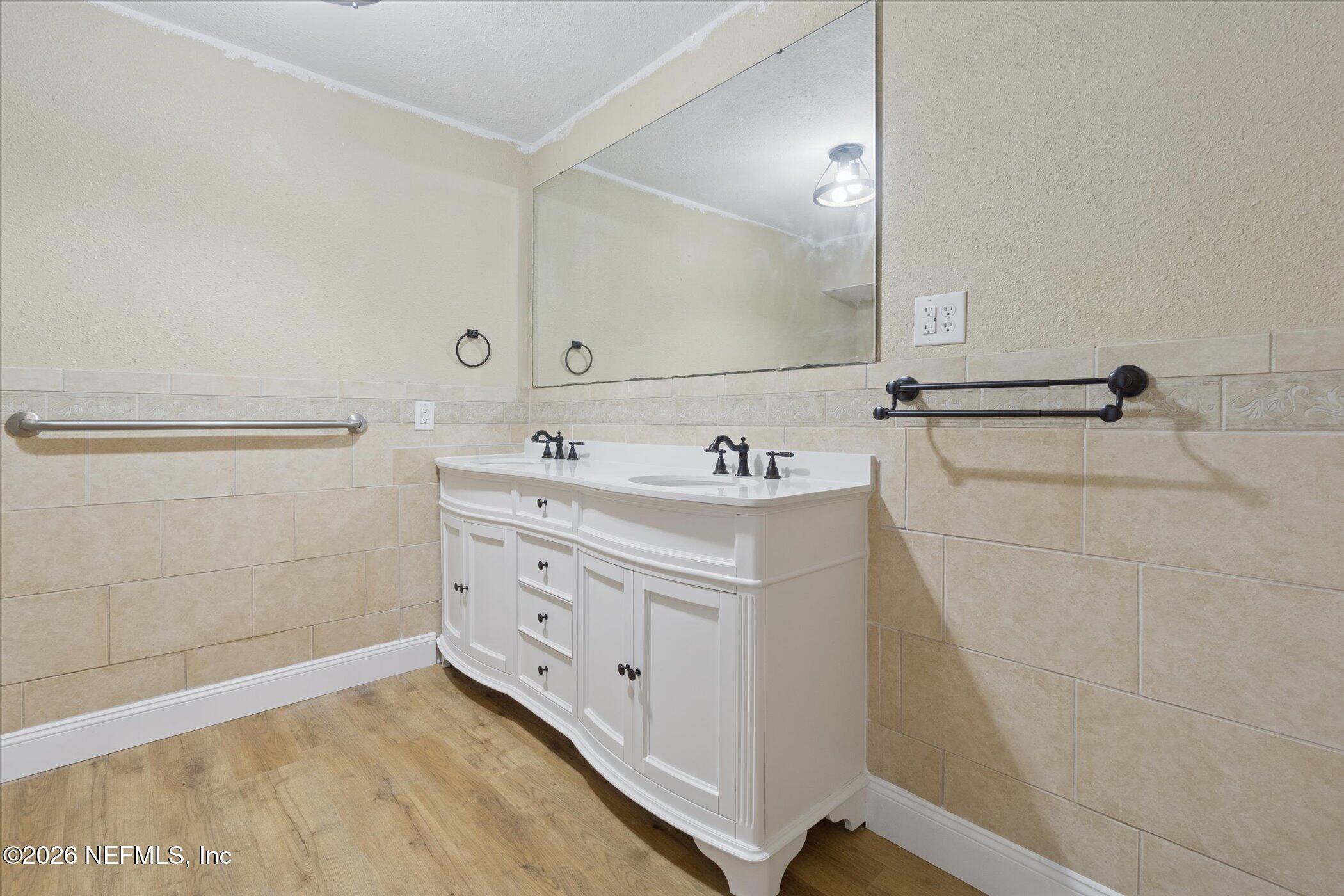 3121 Lannie Road Jacksonville, FL 32218 - Photo 31 of 68 a bathroom with a sink and a mirror