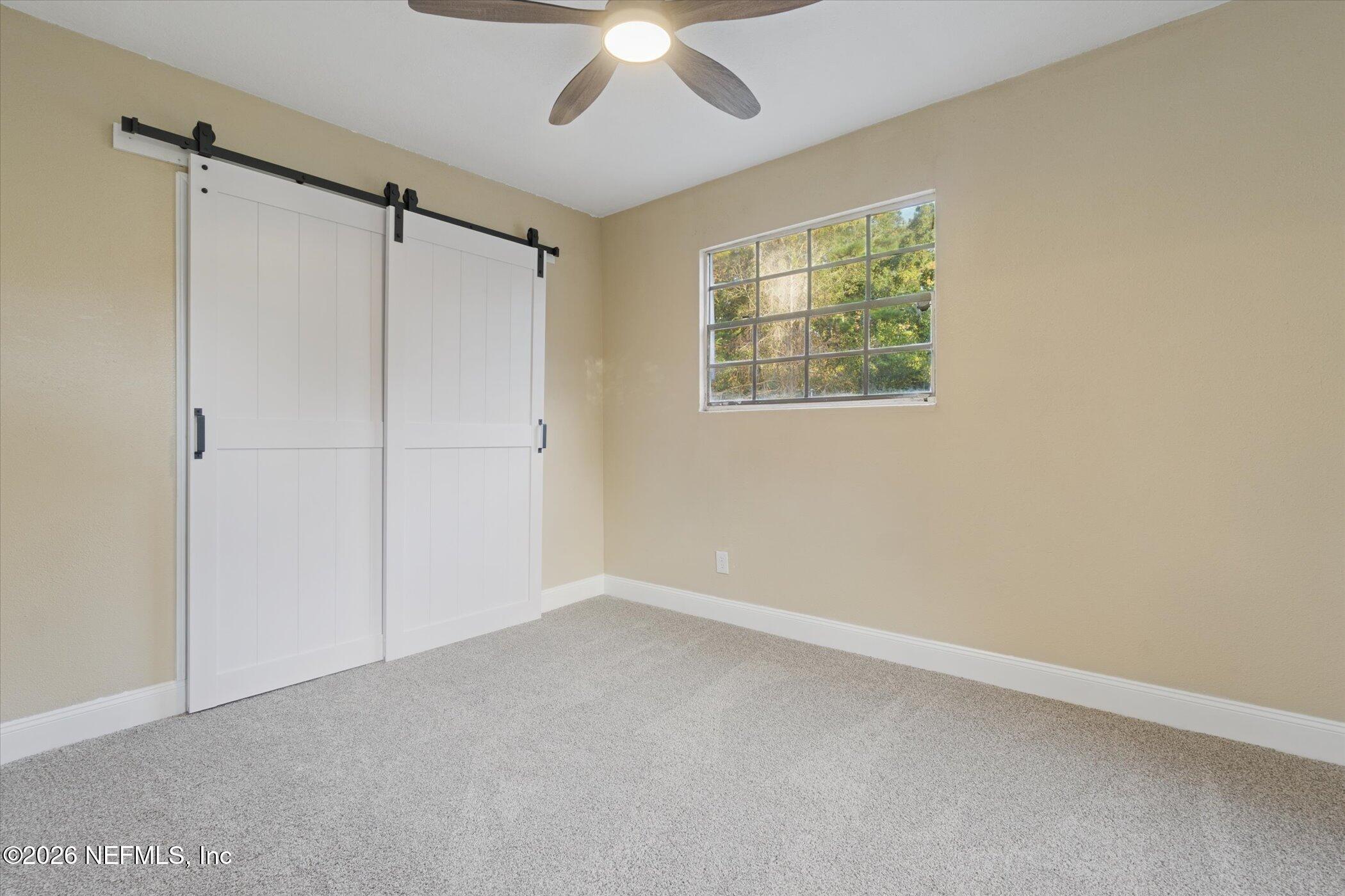 3121 Lannie Road Jacksonville, FL 32218 - Photo 43 of 68 a view of an empty room with a window