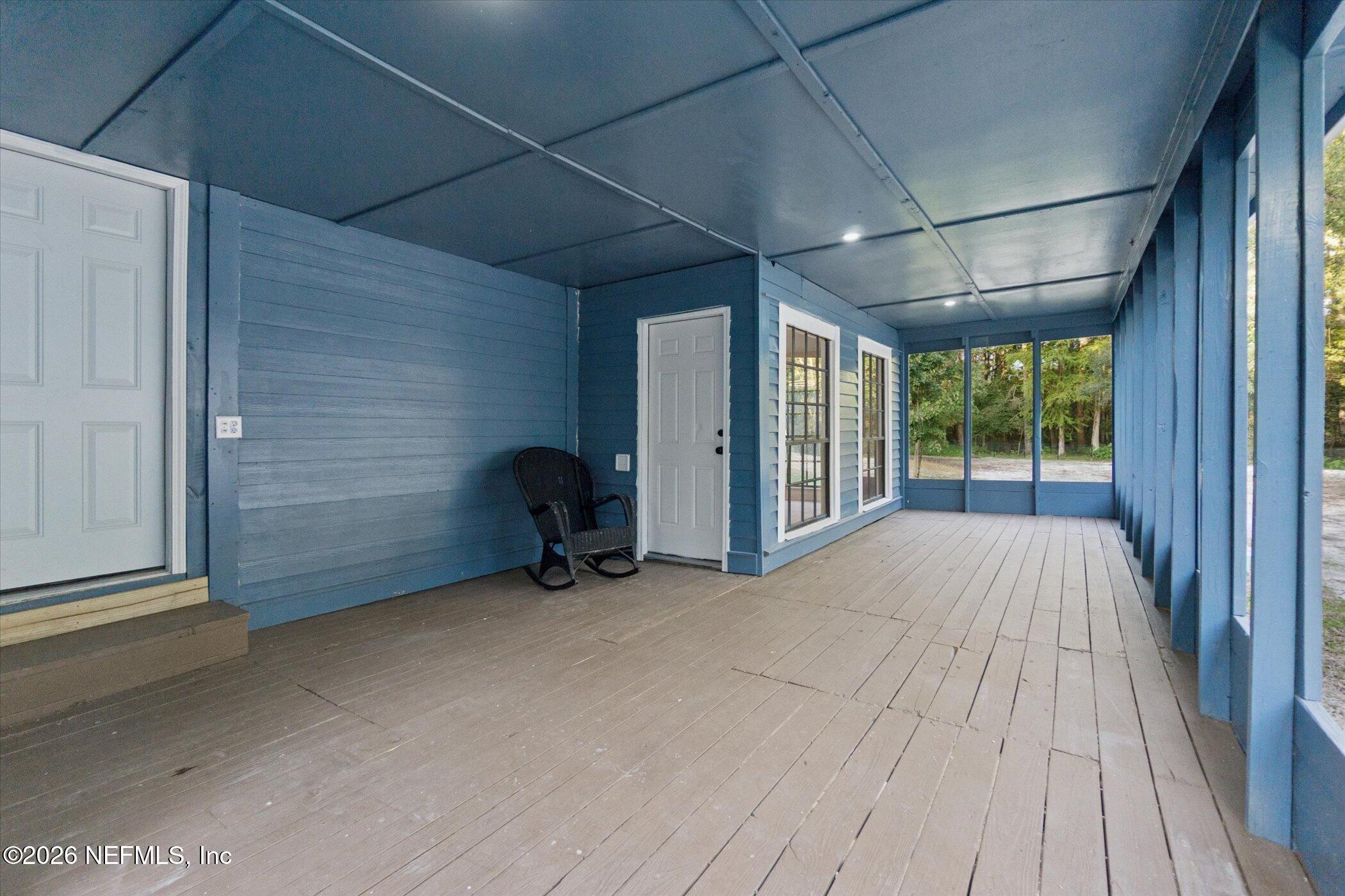 3121 Lannie Road Jacksonville, FL 32218 - Photo 50 of 68 a view of a room with wooden floor and furniture