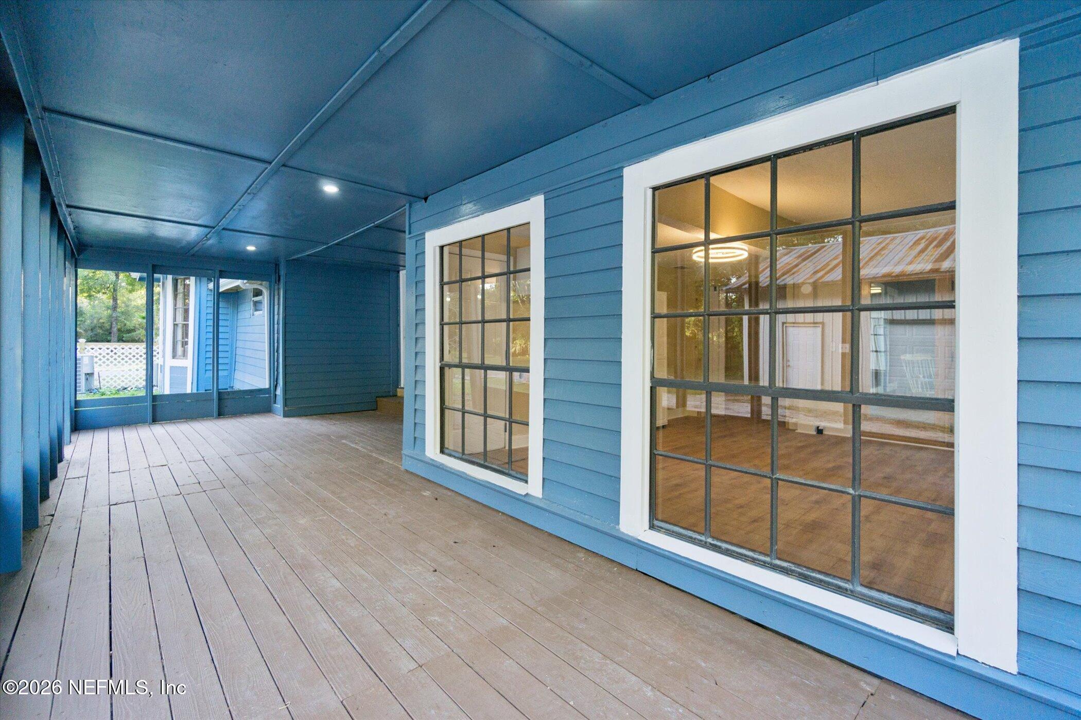 3121 Lannie Road Jacksonville, FL 32218 - Photo 51 of 68 an empty room with wooden floor and windows
