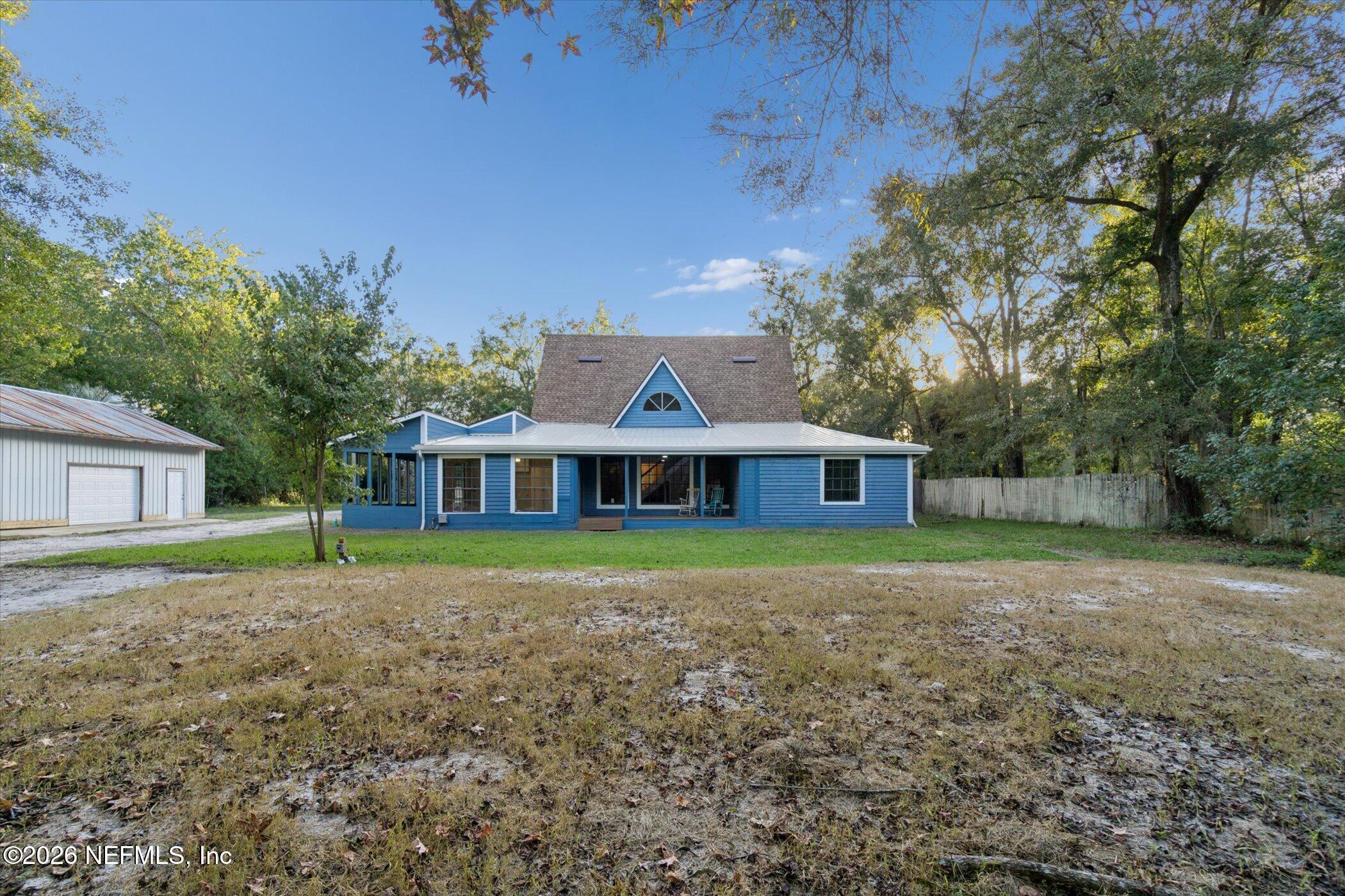 3121 Lannie Road Jacksonville, FL 32218 - Photo 54 of 68 a front view of a house with a yard