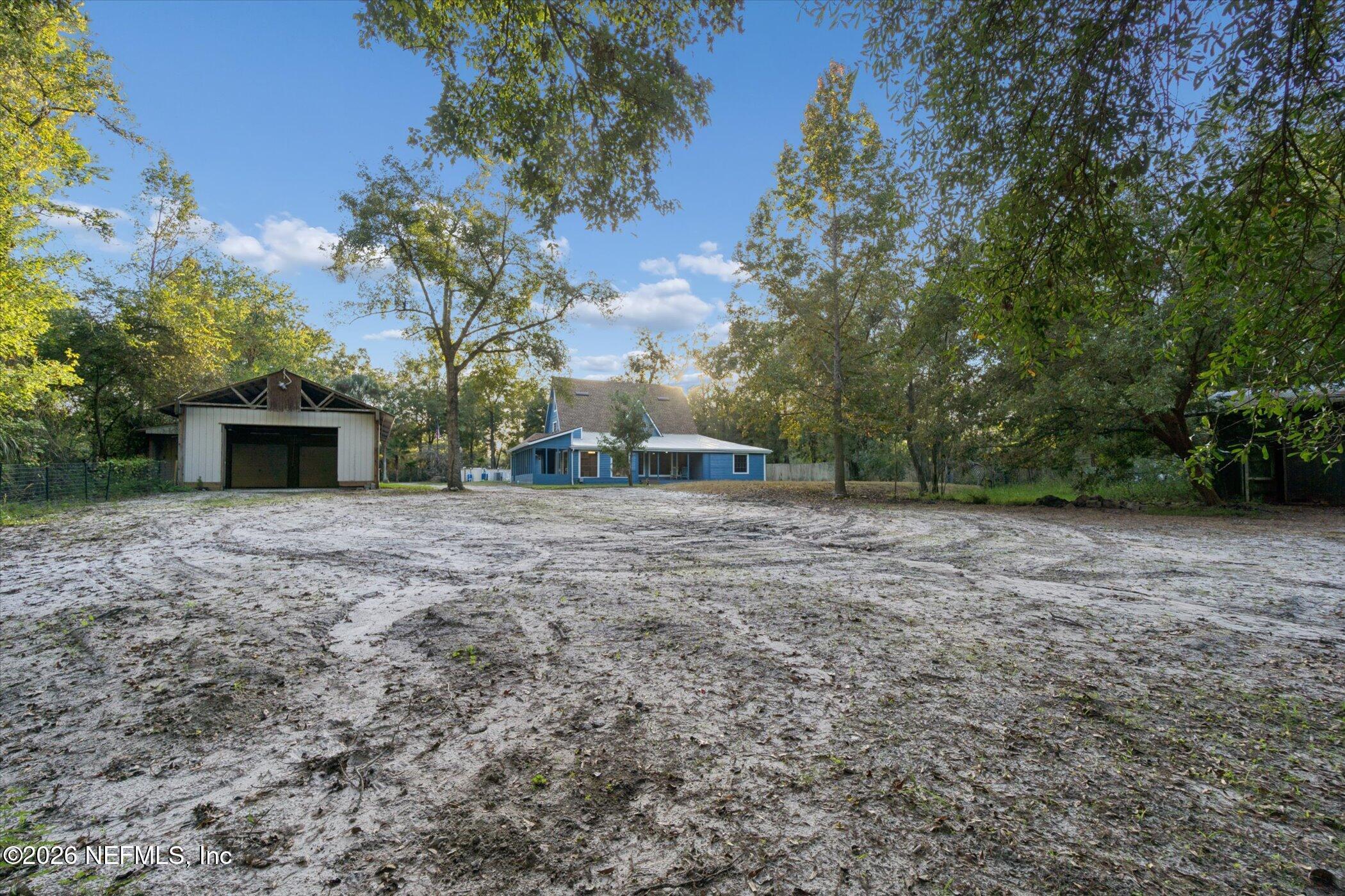3121 Lannie Road Jacksonville, FL 32218 - Photo 55 of 68 a view of a backyard with large trees