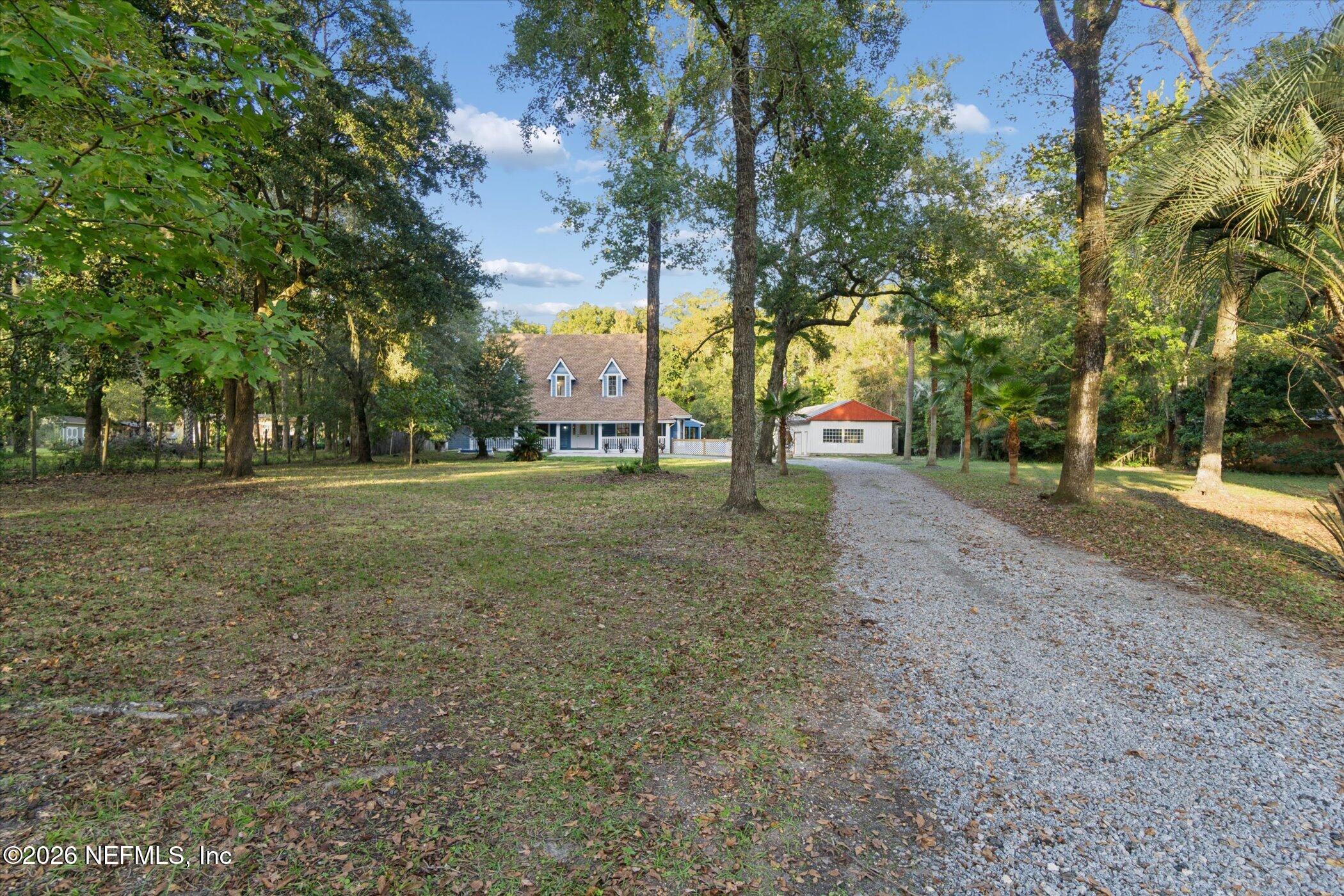 3121 Lannie Road Jacksonville, FL 32218 - Photo 6 of 68 a view of road with trees