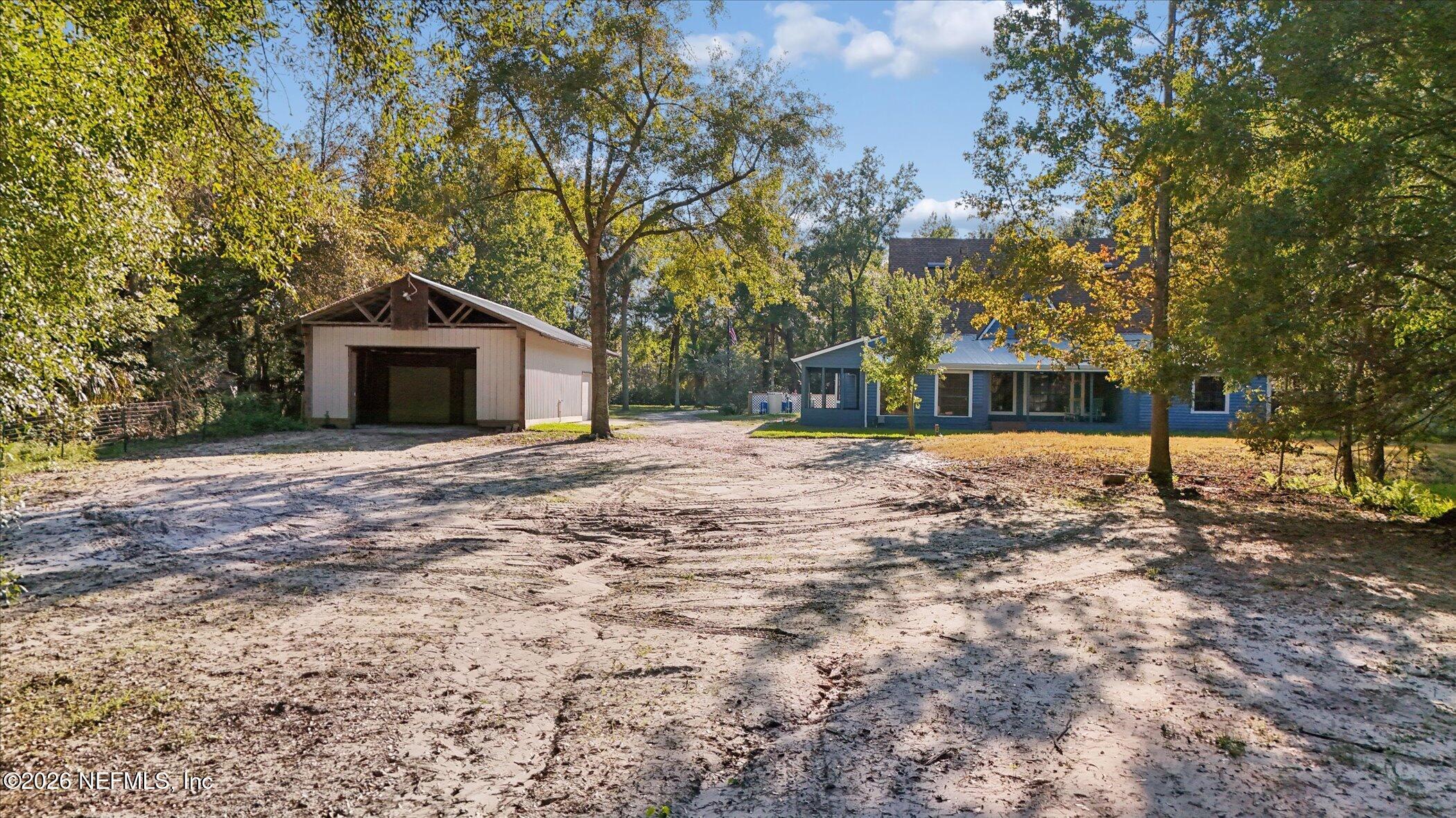 3121 Lannie Road Jacksonville, FL 32218 - Photo 61 of 68 a front view of a house with a yard