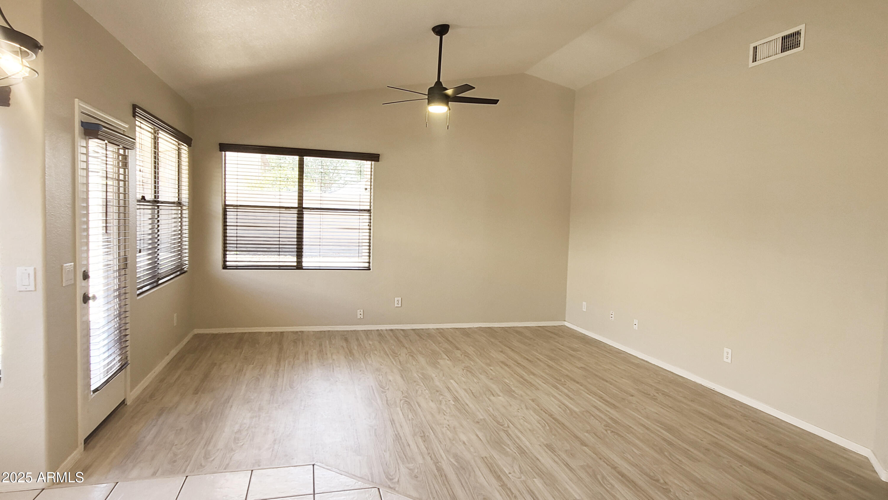 1729 East Pony Lane Gilbert, AZ 85295 - Photo 11 of 31 wooden floor in an empty room with a window