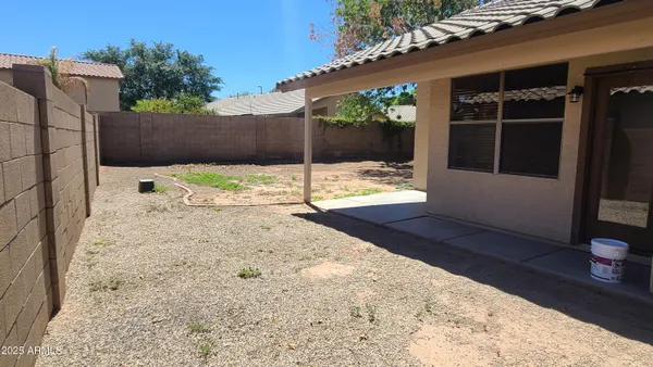 a view of a backyard of the house