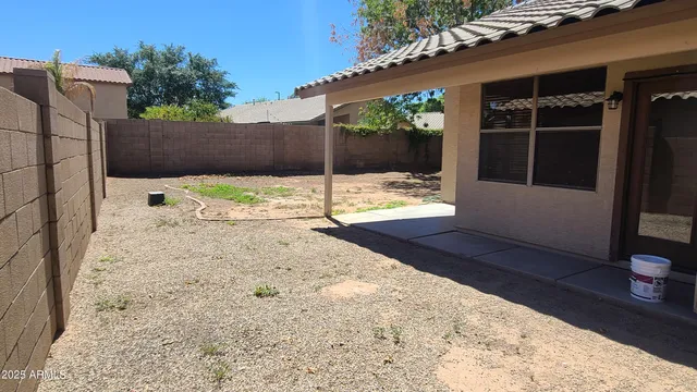 a view of a backyard of the house