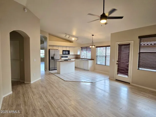 a view of kitchen with cabinets and wooden floor