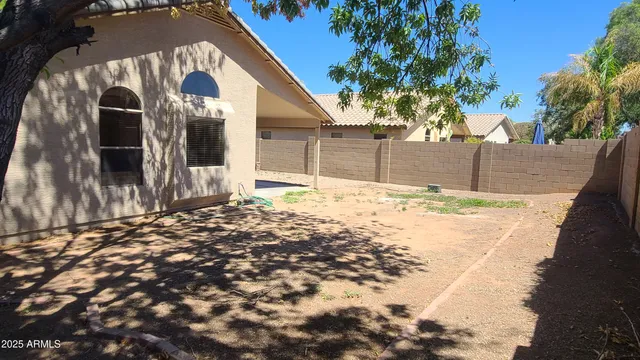 a view of a backyard of the house