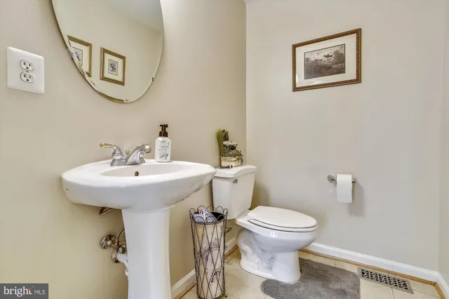 a bathroom with a toilet and a sink