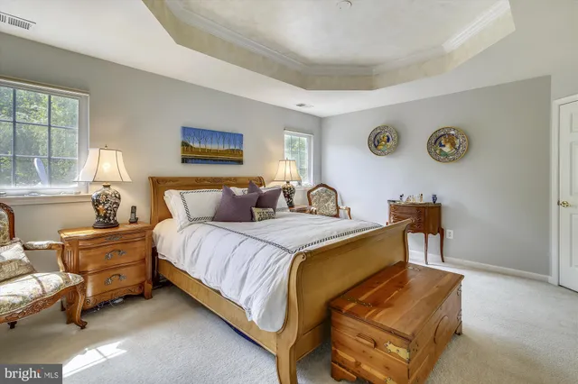 a bed room with a bed and a lamp