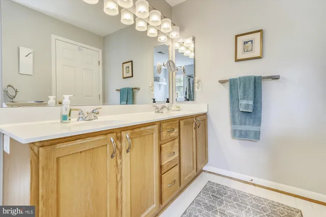 a bathroom with a sink a vanity and a mirror