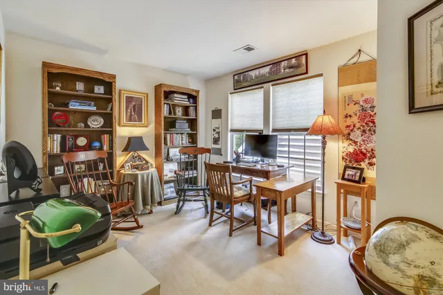 a work room with furniture and a window