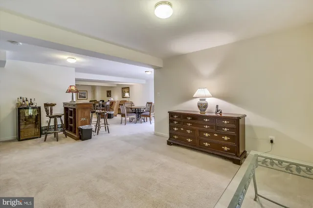 a bed room with furniture and a lamp