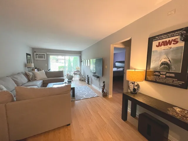 a kitchen with a refrigerator and a stove top oven