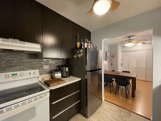 a kitchen with a sink and refrigerator