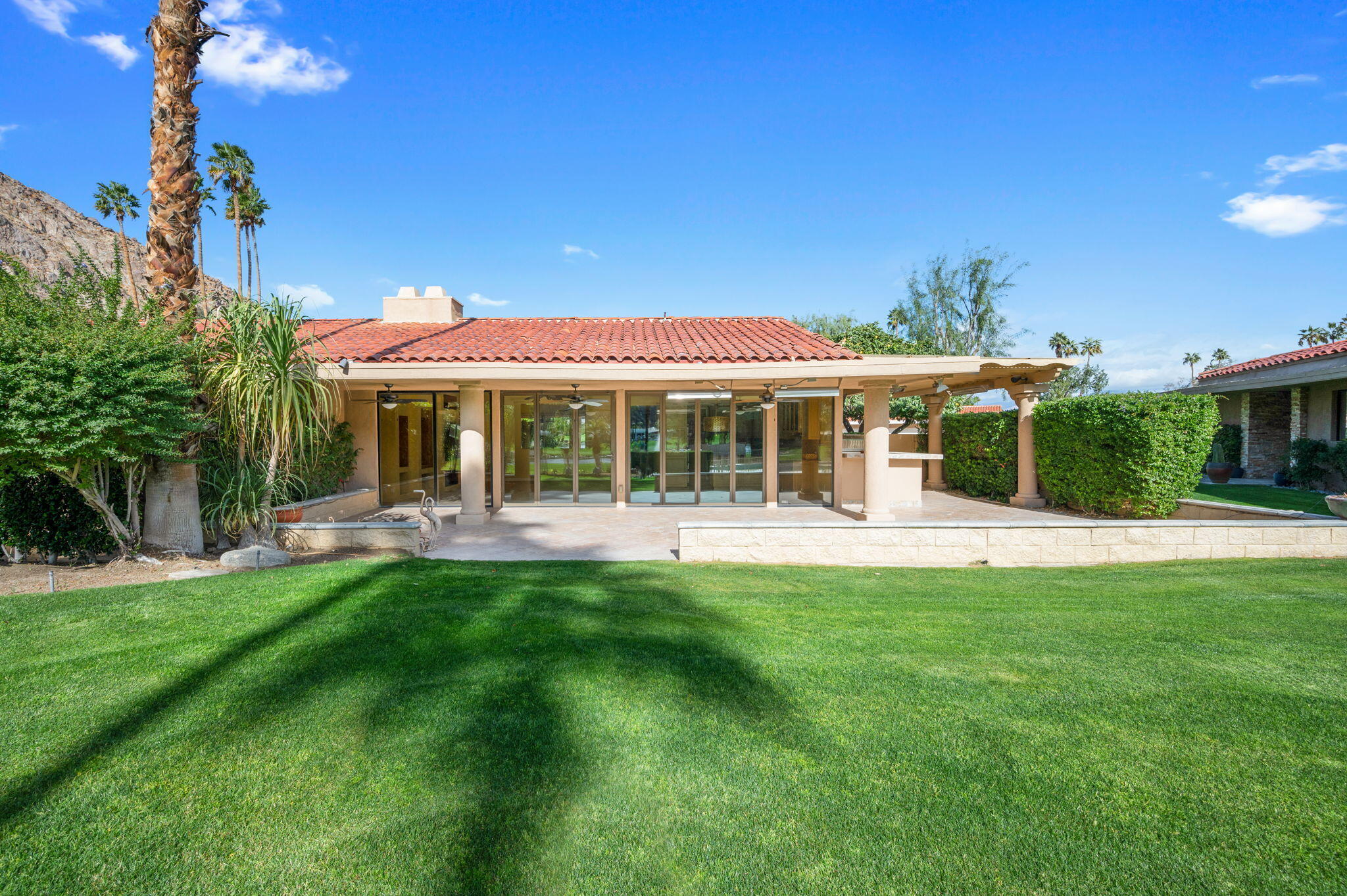 77675 Seminole Road Indian Wells, CA 92210 - Photo 37 of 40 a front view of a house with a yard