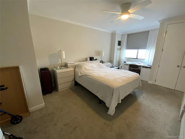 a bed room with a bed and a chair