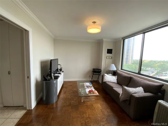 a living room with furniture and a large window