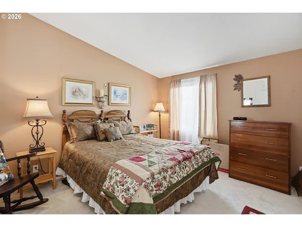 a bedroom with a bed and dresser