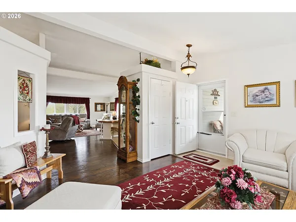 a living room with furniture rug and window
