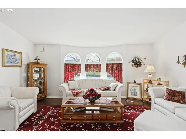 a view of a floor to ceiling window and wooden floor