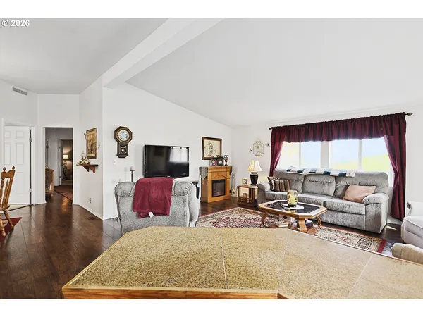a living room with furniture and a large window
