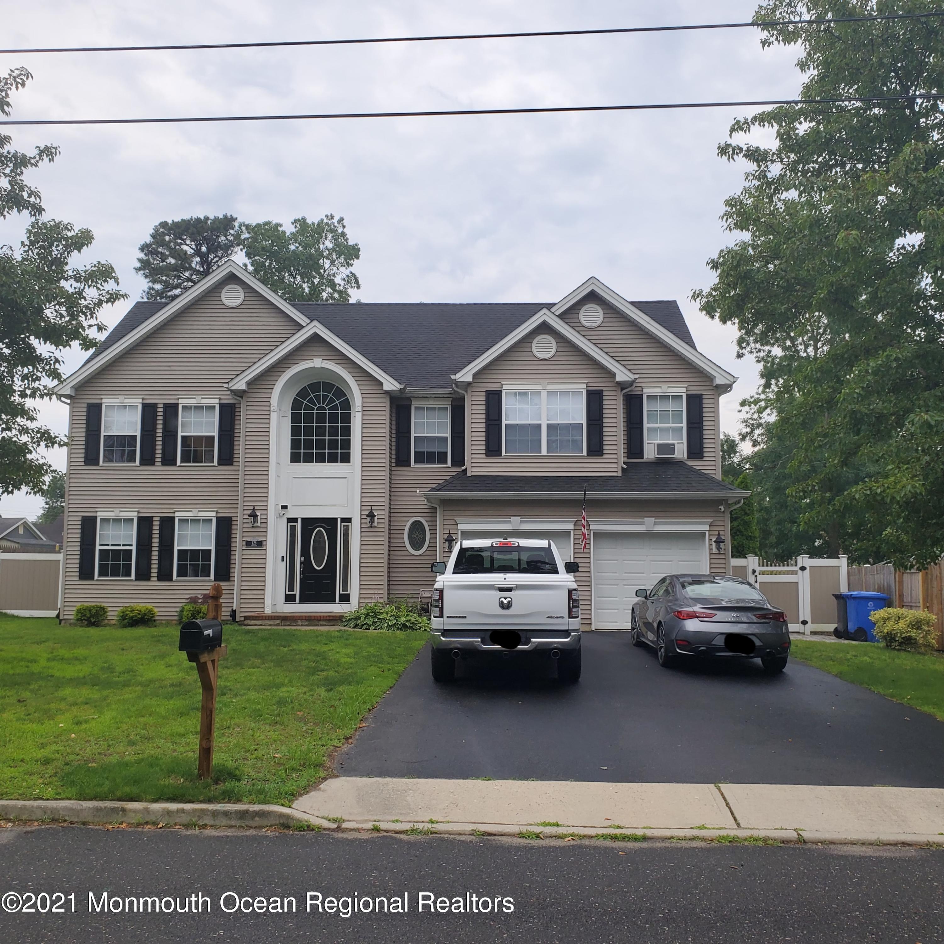 128 Captain Road Manahawkin, NJ 08050 - Photo 1 of 20 a car parked in front of a house