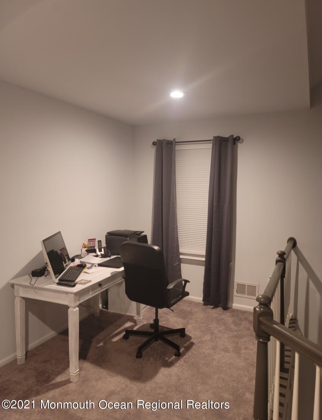 128 Captain Road Manahawkin, NJ 08050 - Photo 13 of 20 a view of a workspace with furniture