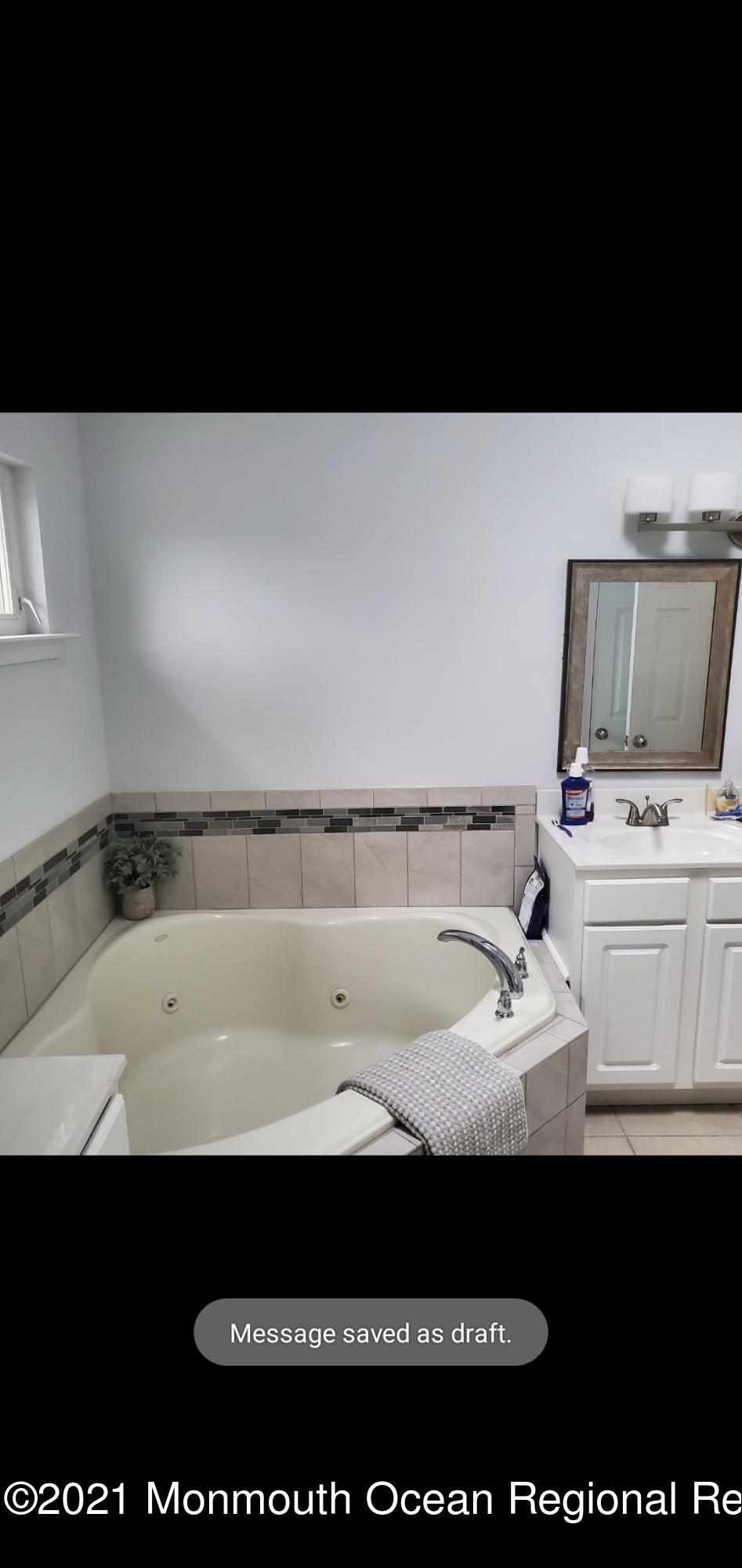 128 Captain Road Manahawkin, NJ 08050 - Photo 15 of 20 a black and white photo of a sink
