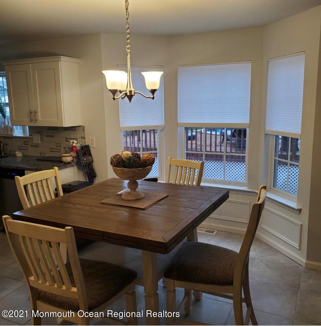 128 Captain Road Manahawkin, NJ 08050 - Photo 5 of 20 a view of a dining room with furniture