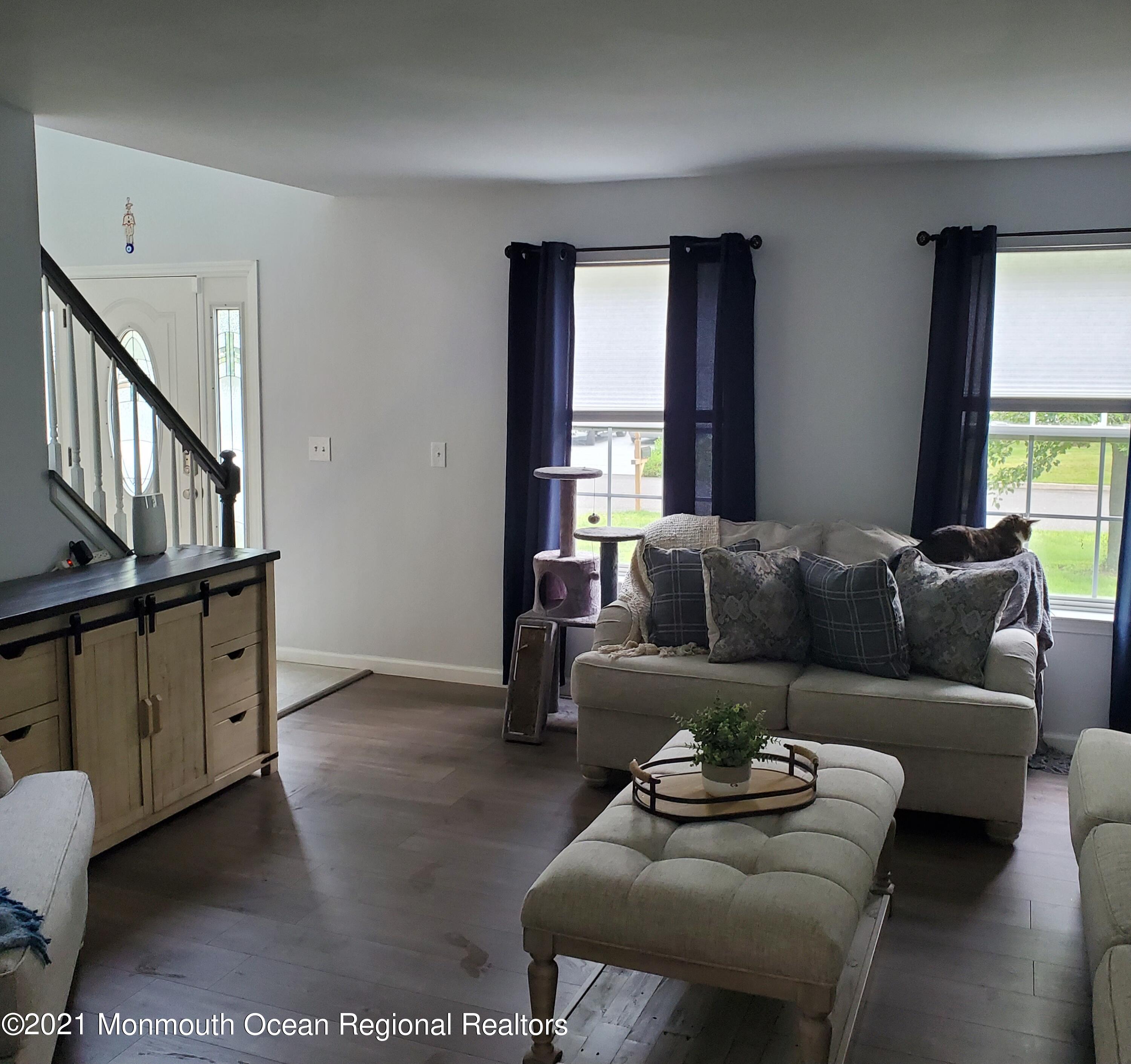 128 Captain Road Manahawkin, NJ 08050 - Photo 6 of 20 a living room with furniture and a window