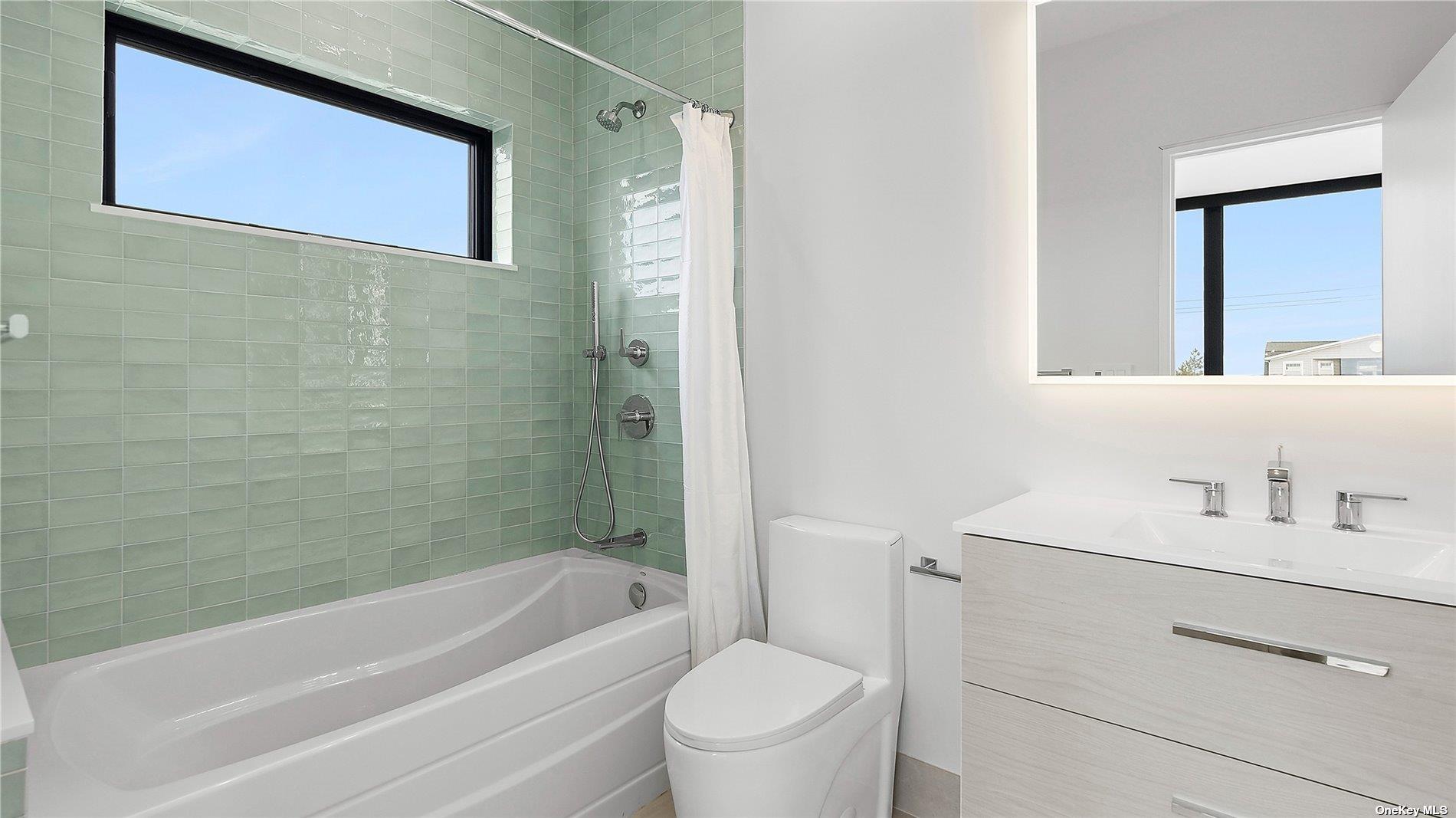 314 Dune Road Westhampton Beach, NY 11978 - Photo 8 of 18 a bathroom with a sink a toilet and shower