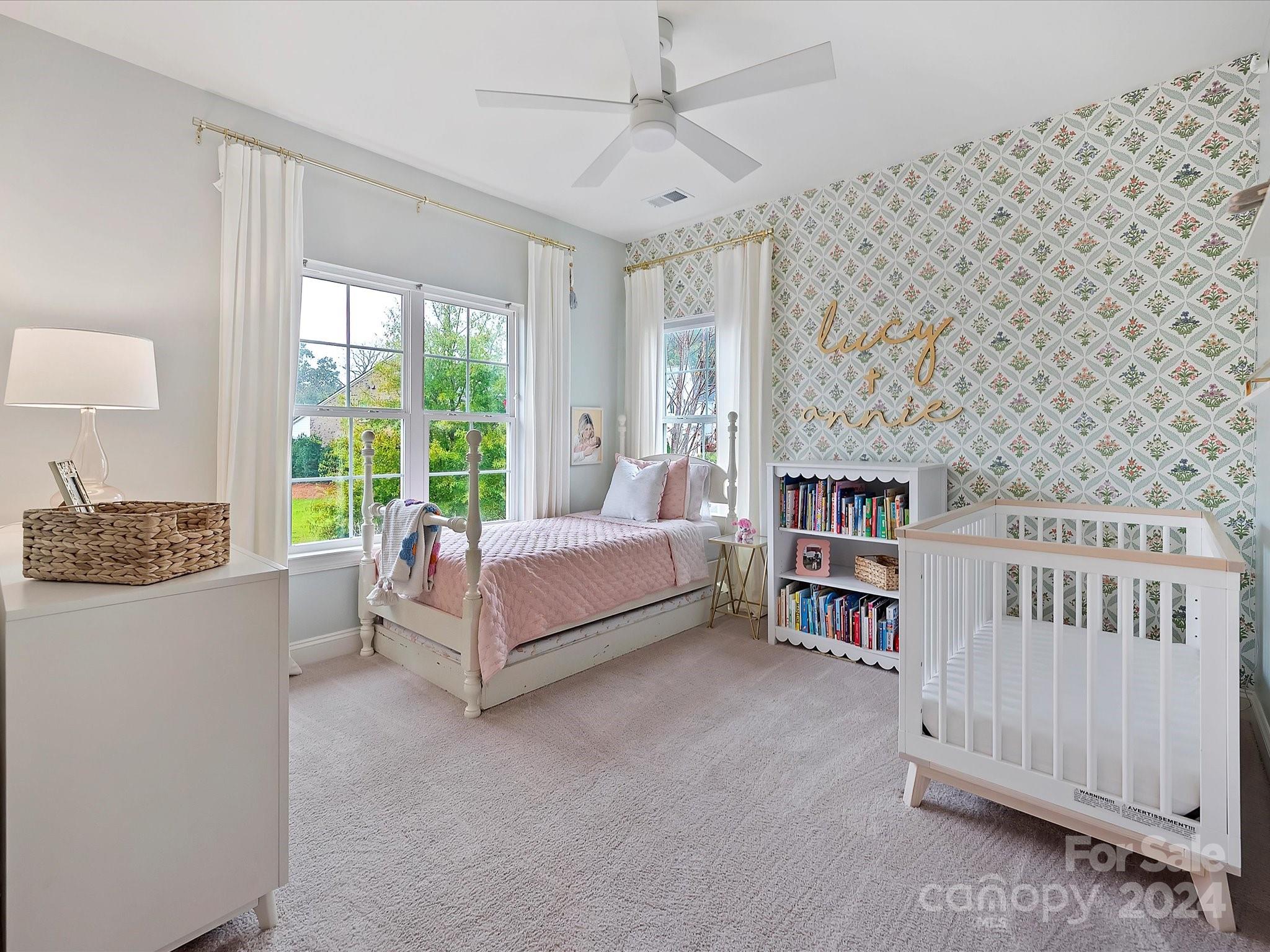 12027 Huntson Reserve Road Huntersville, NC 28078 - Photo 29 of 42 a spacious bedroom with a bed and a large window