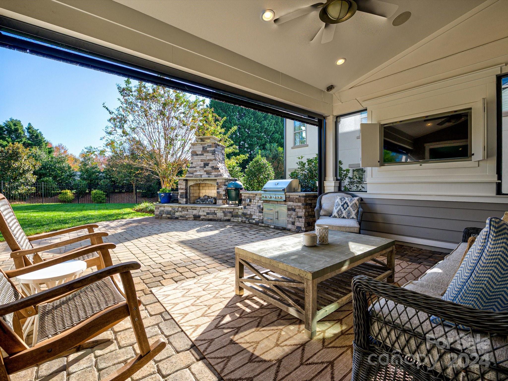 12027 Huntson Reserve Road Huntersville, NC 28078 - Photo 3 of 42 a view of a patio with a dining table and chairs