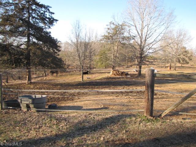 830 Beck Road Eden, NC 27288 - Photo 1 of 38 Three fenced pastures provide for immediate farming, if desired.