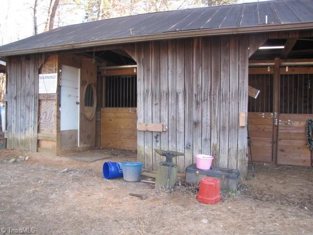 830 Beck Road Eden, NC 27288 - Photo 22 of 38 This barn has 3 10 x 10 stalls and two tack/feed rooms. Stalls made of treated lumber.