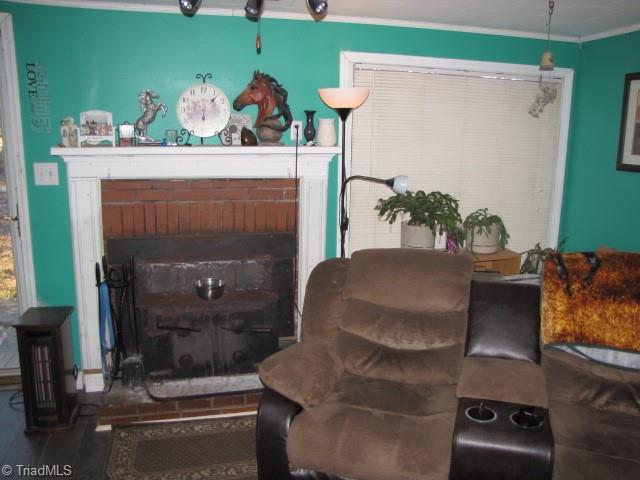 830 Beck Road Eden, NC 27288 - Photo 33 of 38 Fireplace with wood burning insert that conveys.