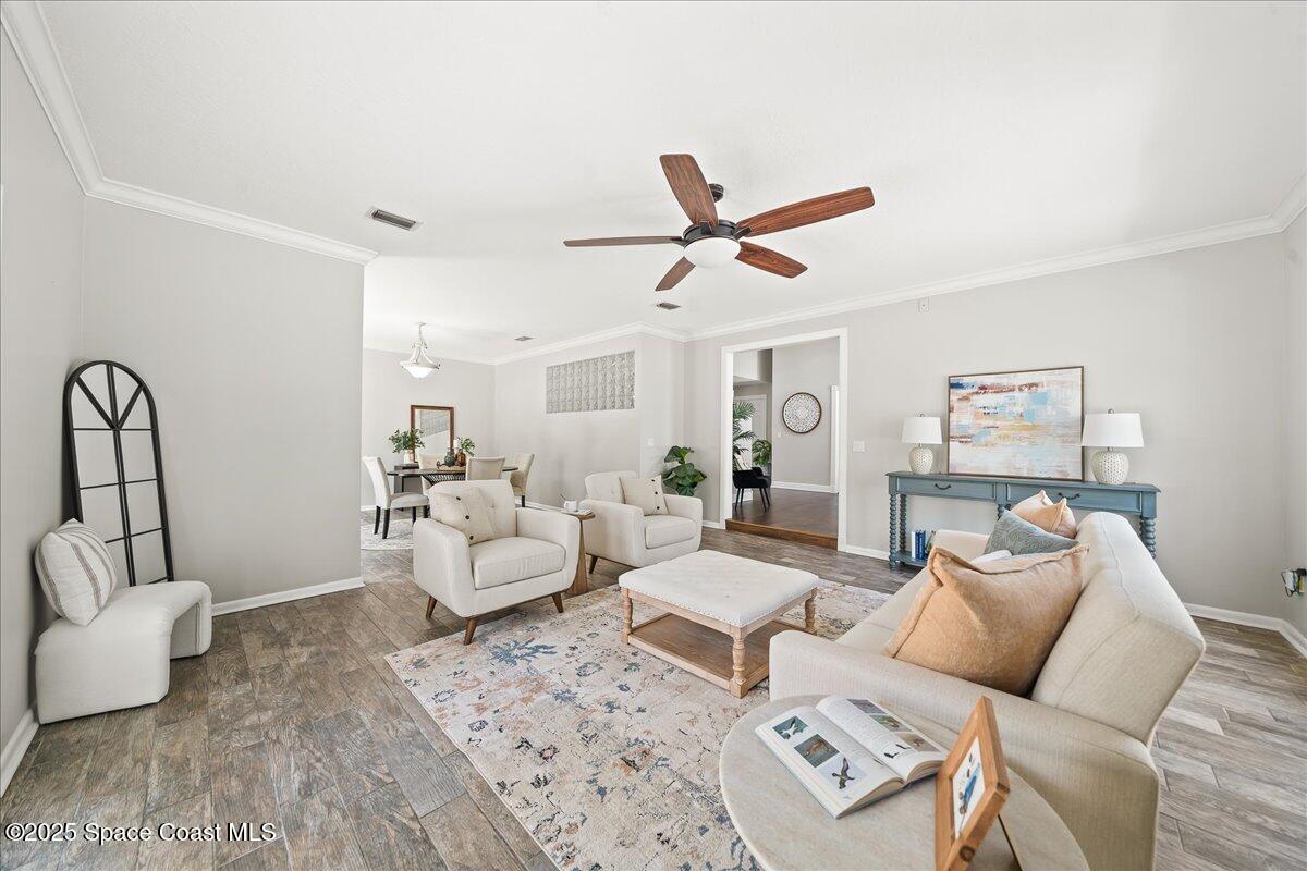 505 Sanderling Drive Indialantic, FL 32903 - Photo 11 of 63 a living room with furniture and a large window