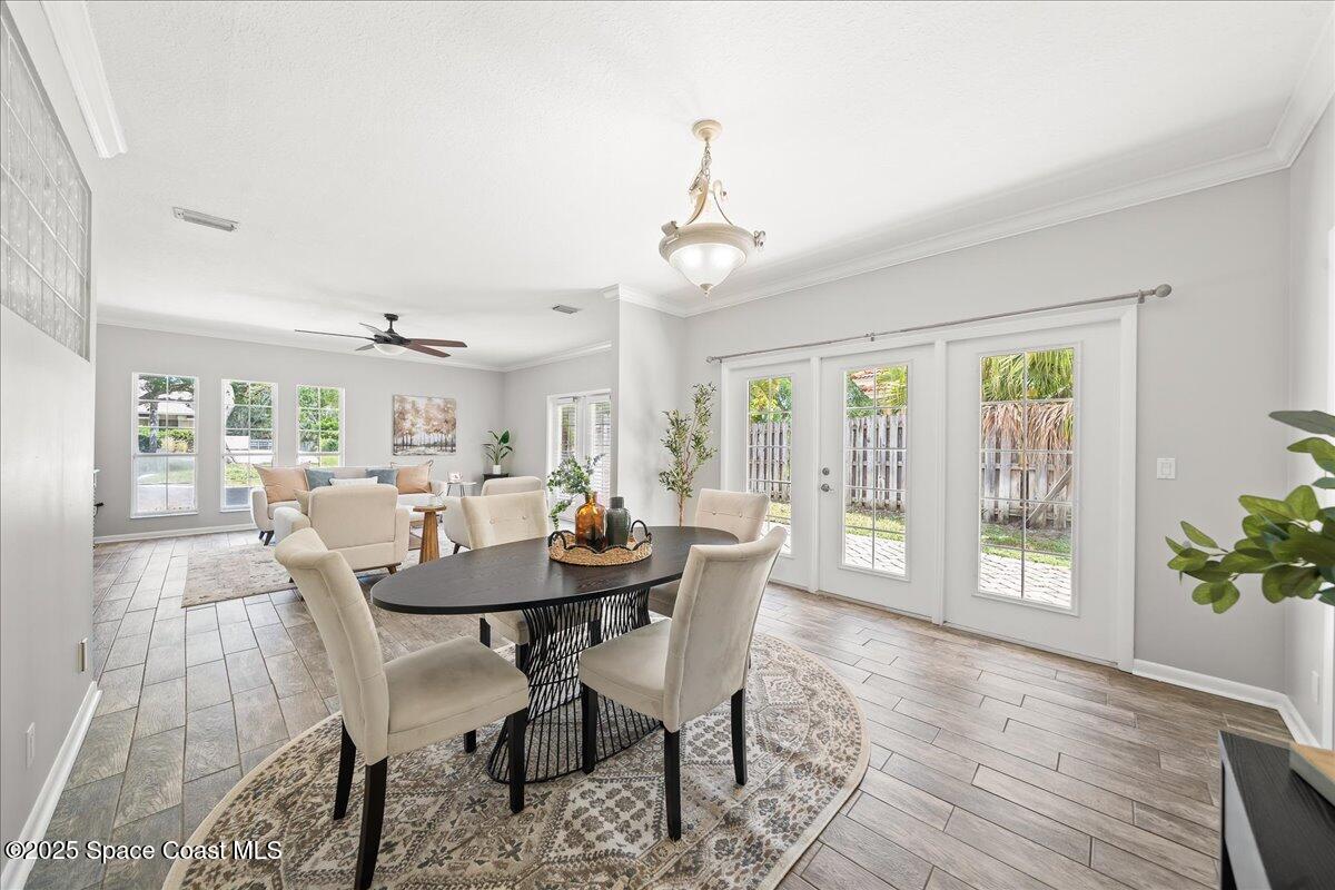 505 Sanderling Drive Indialantic, FL 32903 - Photo 12 of 63 a view of a dining room with furniture window and wooden floor