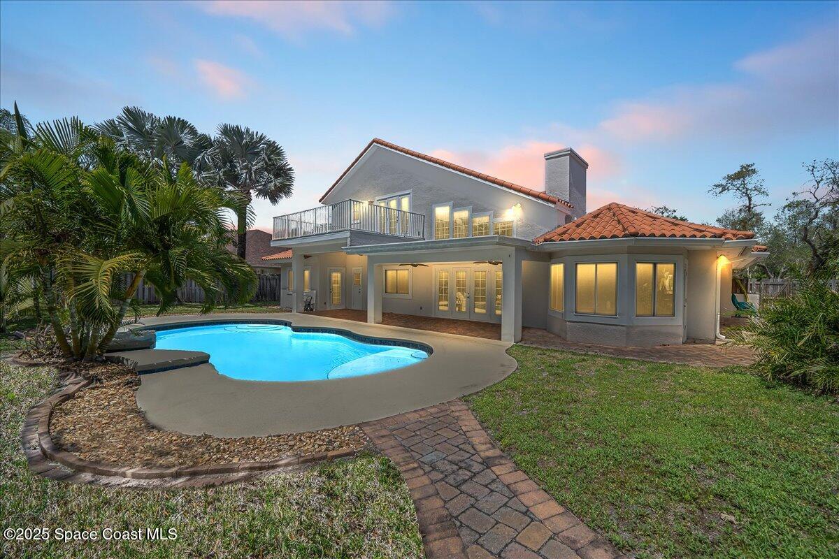 505 Sanderling Drive Indialantic, FL 32903 - Photo 2 of 63 a view of a house with a swimming pool and a yard