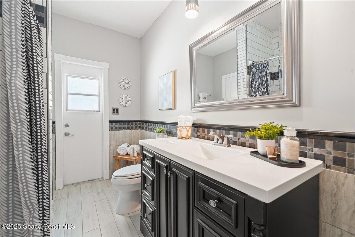505 Sanderling Drive Indialantic, FL 32903 - Photo 28 of 63 a bathroom with a sink and a mirror